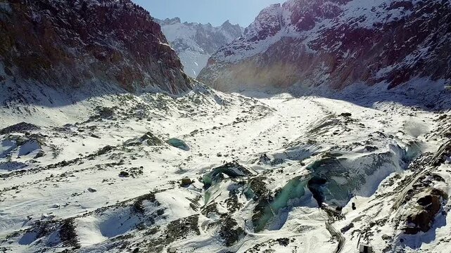 Sea of ​​Ice Glacier, aerial view. Glacial valley with ice and rocks. Panoramic view of the largest glacier in France. Chamonix-Mont Blanc. French Alps.