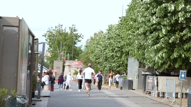 Caucasian Man Jogging Along the Seine Riverbank in Paris France
