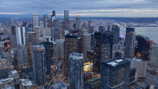 7th of February 2026 Drone flight above the Seattle downtown skyline with Amazon Spheres and modern office towers at blue hour, Washington USA. g.