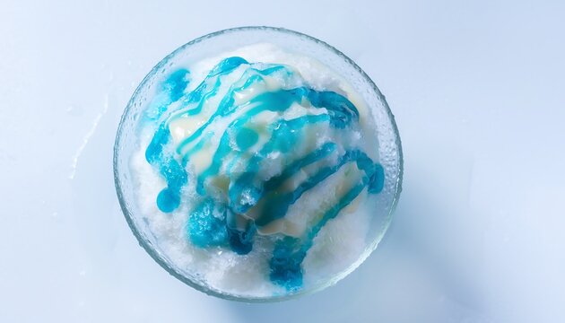 Top view of Japanese shaved ice with blue hawaii syrup and sweet condensed milk in a glass bowl