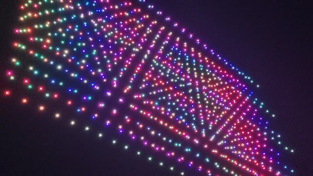 A swarm of drones performing at night.
