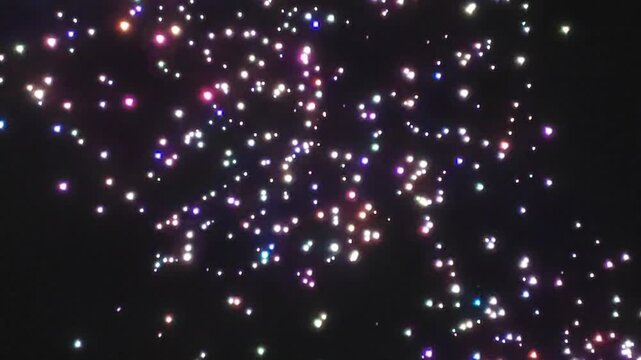 A swarm of drones performing at night.
