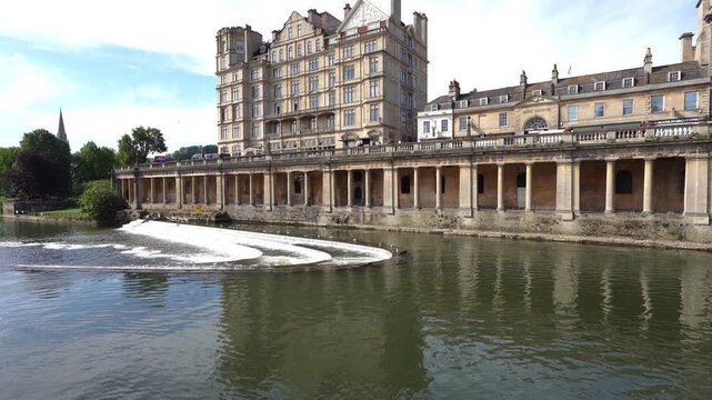 Bath, UK - May 12, 2026: Flow of Avon River and North Parade Bridge in Bath in England