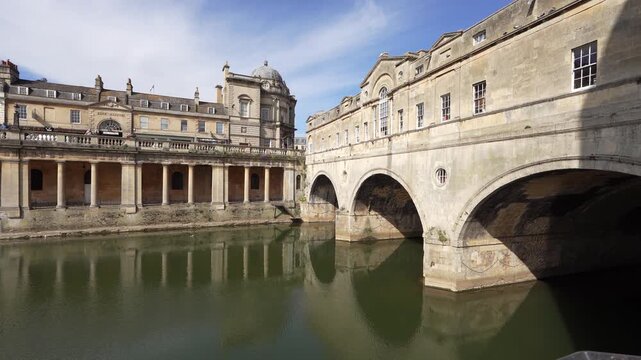 Bath, UK - May 12, 2026: Flow of Avon River and North Parade Bridge in Bath in England
