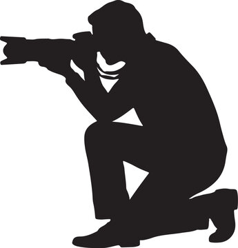 Silhouette of a Professional Photographer Kneeling with a DSLR Camera