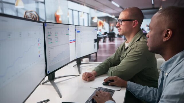 Digital Marketing Managers Analyze Online Ad Campaign Results Together