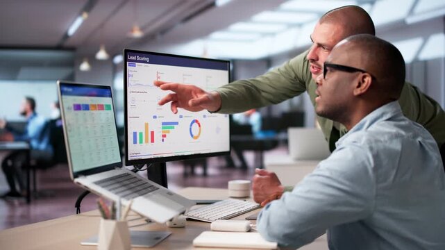 Sales Manager Reviews Lead Scoring Dashboard