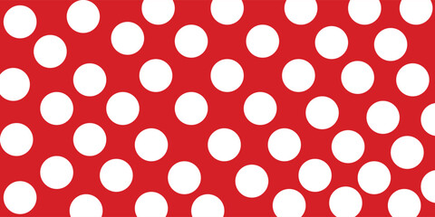 Classic red and white polka dot seamless pattern background. © ceisya