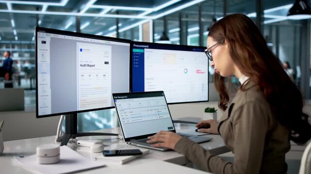 Risk Manager Carefully Analyzes Data On Laptop