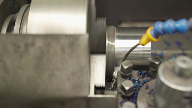 Lathe industrial turning machine operation. Cnc milling machine in operation with metal gear. Precision alignment ensures secure clamping.