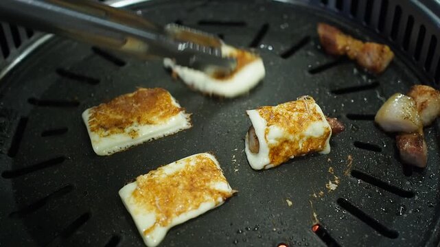 Making hot cheese with Korean grill pork belly BBQ (Samgyeopsal Gui) - trendy Korean barbecue dish, served with fresh vegetable and dipping sauce