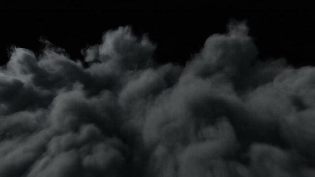 Dark grey smoke plume billowing continuously against a pure black background. Thick atmospheric fog rolling smoothly for visual effects. Static camera capturing dramatic storm clouds.