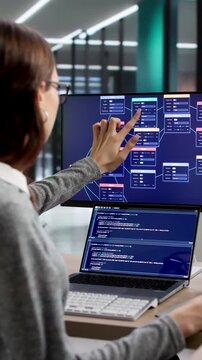 Woman Focused On Programming Using Nodes