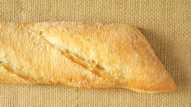 Freshly baked french baguette bread sliding