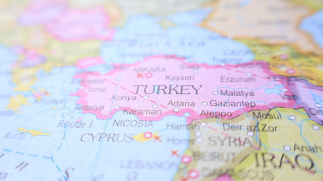Macro view of Turkey and Cyprus on a colorful world map. Discover Turkish cities and explore the region. Travel and geography.