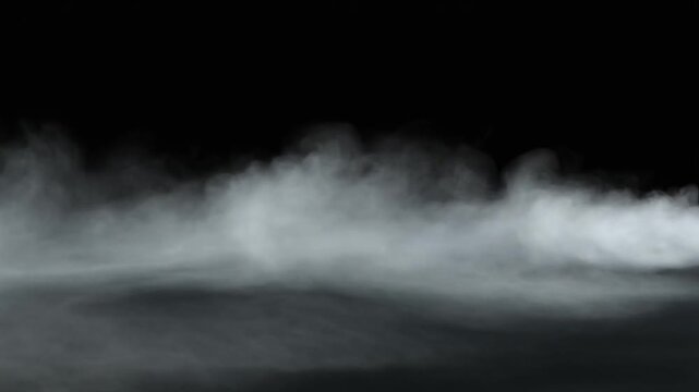White smoke and dense fog layer isolated on black background. Realistic mist clouds moving horizontally. Atmospheric vapor effect for cinematic video production and creative visual overlays.