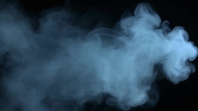 Blue smoke puff and ethereal vapor cloud against a black background. Abstract wispy mist with soft lighting. Cinematic atmosphere for mystery or sci-fi video projects. Static.
