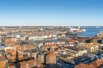 Fototapeta premium Copenhagen Cityscape, Historic Canalside Buildings, Christianshavn Canal, Urban Skyline