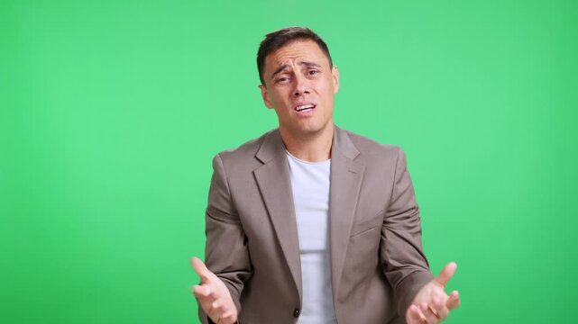 Desperate man pleading and begging on green screen background