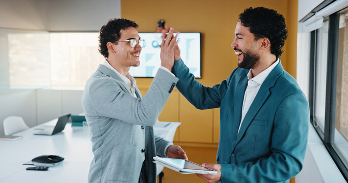 Team, tablet and business people in office with high five, data analysis and success for profit growth. Happy, men and celebration with tech, performance statistics and graphs for revenue increase.