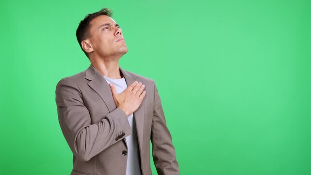 Patriotic man pledging allegiance with hand over heart