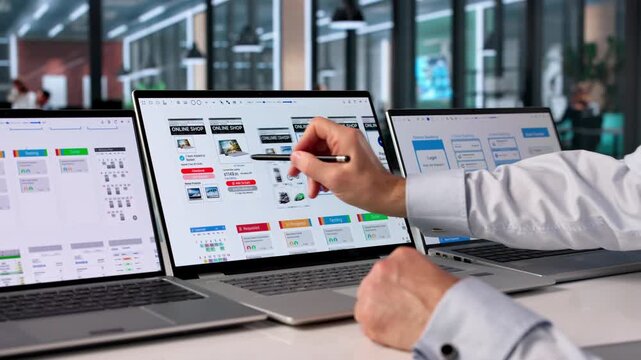 Man Focused On Computer Screen Developing User-friendly App