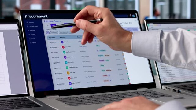 Procurement Manager Reviews Supplier Contracts Using Software