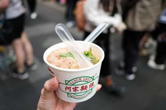Taipei, Taiwan - April 24, 2026 : Ay-Chung Flour Rice Noodle is famous local food of Ximending, Street food at Taipei.