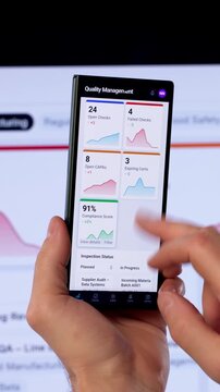 Quality Manager Reviews Corrective Actions On Smartphone