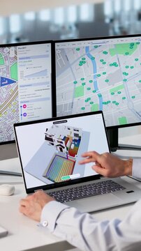 HVAC Engineer Using Laptop Designs Sustainable Heat Pump System