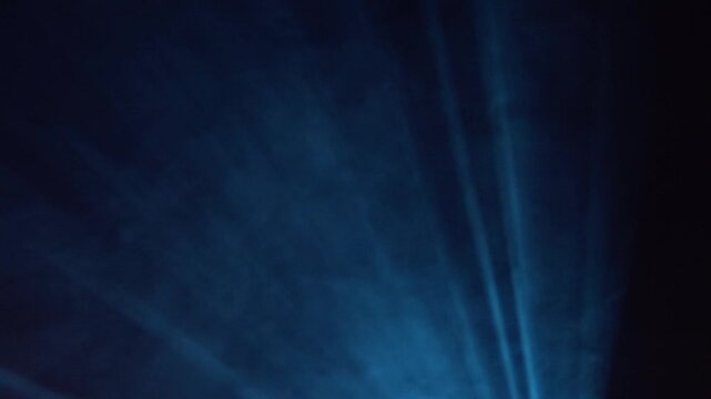 Blue Light Rays Abstract Background With Stage Spotlight Effect and Dramatic Dark Atmosphere