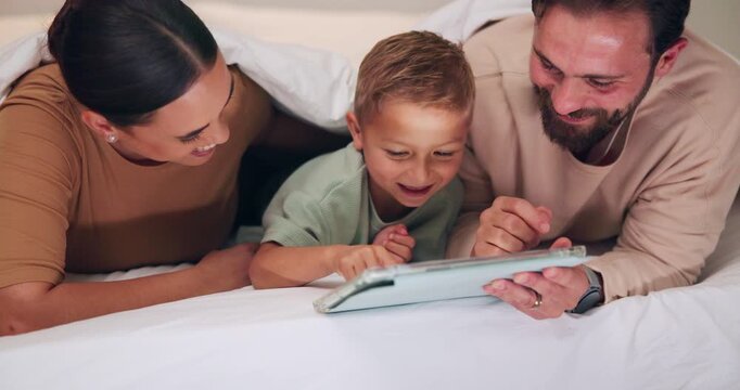 Tickle, tablet and parents with child on bed for bonding with videos, internet and connection at night. Family, home and happy mom, dad and boy on tech for playful relationship, laughing and relax
