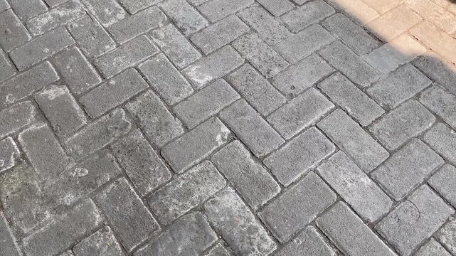 Close up of concrete interlocking paver road
