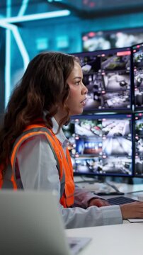 Security Guard Monitors Multiple CCTV Cameras