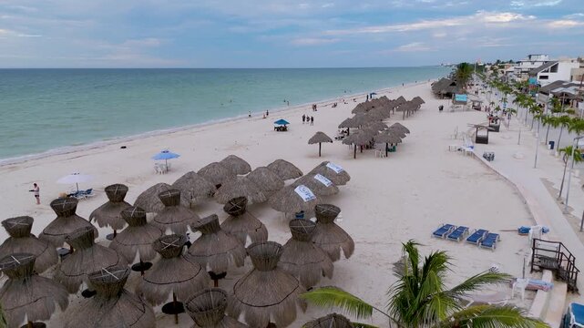 Aerial landscape shot captures the vibrant seaside promenade, known as the Malecon, stretching along the coast of Progreso, Yucatan. Mexico.