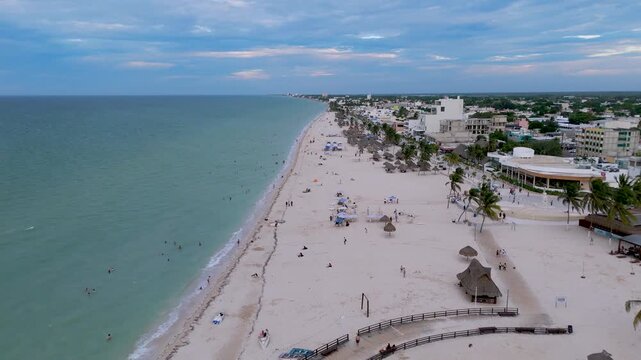 Aerial landscape shot captures the vibrant seaside promenade, known as the Malecon, stretching along the coast of Progreso, Yucatan. Mexico.