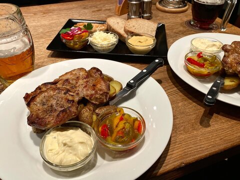 View of a steak with appetizers in a bar in Prague, Czech Republic.