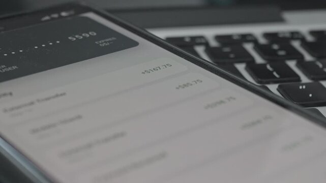 Digital Fintech Concept Showing Credit Card Details and Payment Activity on Phone Screen