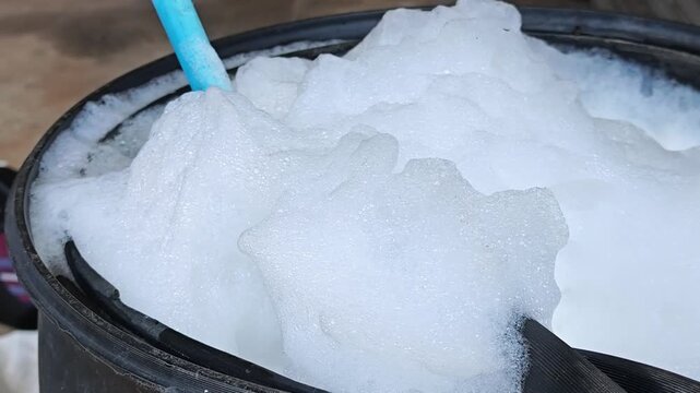 Mixing termiticide solution. Diluting termiticide.