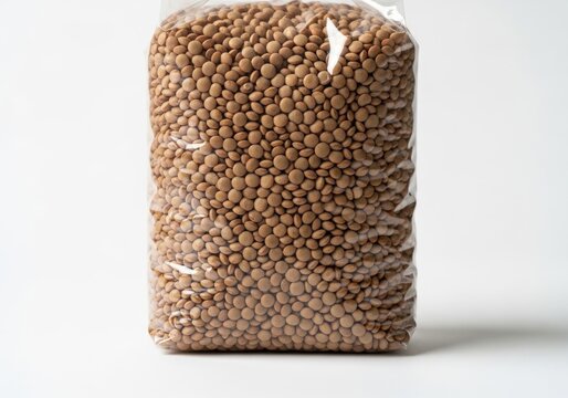 Close-up of brown lentils and split peas mix in bulk isolated on white background