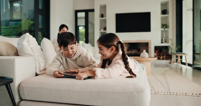 Fight, siblings and children on sofa with tablet to share for online games, internet or streaming. Family, home and kids with conflict on digital tech for cartoon choice, movies and videos on website