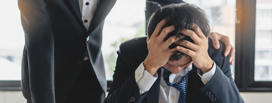 Business Team leader consoling employees work failure job and feeling depressed in workplace.