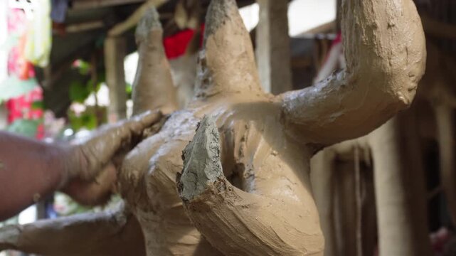 Clay idol creation of kali maa with devotional craftsmanship