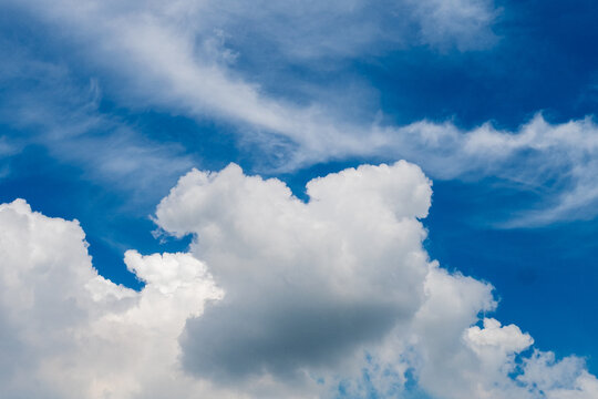 Blue sky fluffy white clouds on summer season bright clear skyline with beautiful cloudscape. Heaven blue environment ecology high scenic nature. Tropical summer blue sky fluffy white cloud