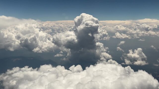 Airplane View of Cumulus Clouds During Flight