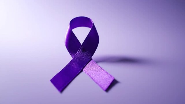 Purple ribbon symbol on a purple backdrop.