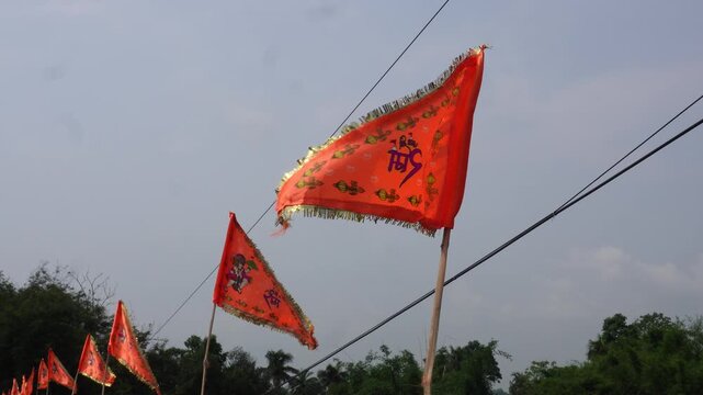Vibrant hindu flags waving proudly during festive celebration