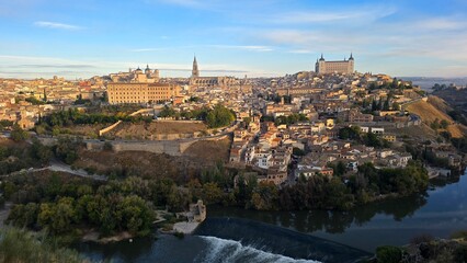 Fototapeta premium Panoramic view of historic Toledo skyline and Tagus river at sunrise.