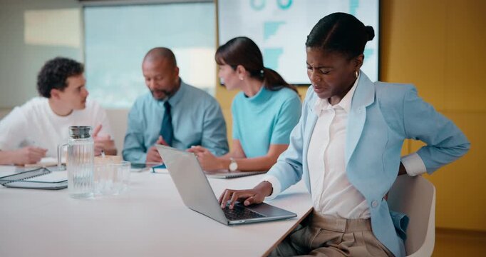 Woman, meeting or laptop with back pain in boardroom for bad posture or discomfort in office. Female person, sore spine or injury with computer or team in conference for overworked strain or pressure