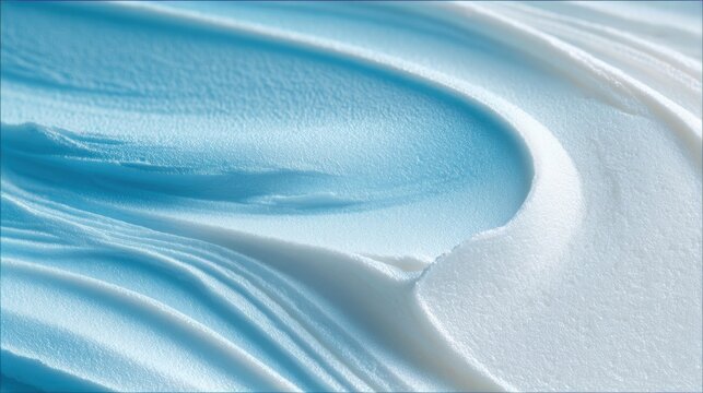 Cream swirls in light blue and white texture on flat surface